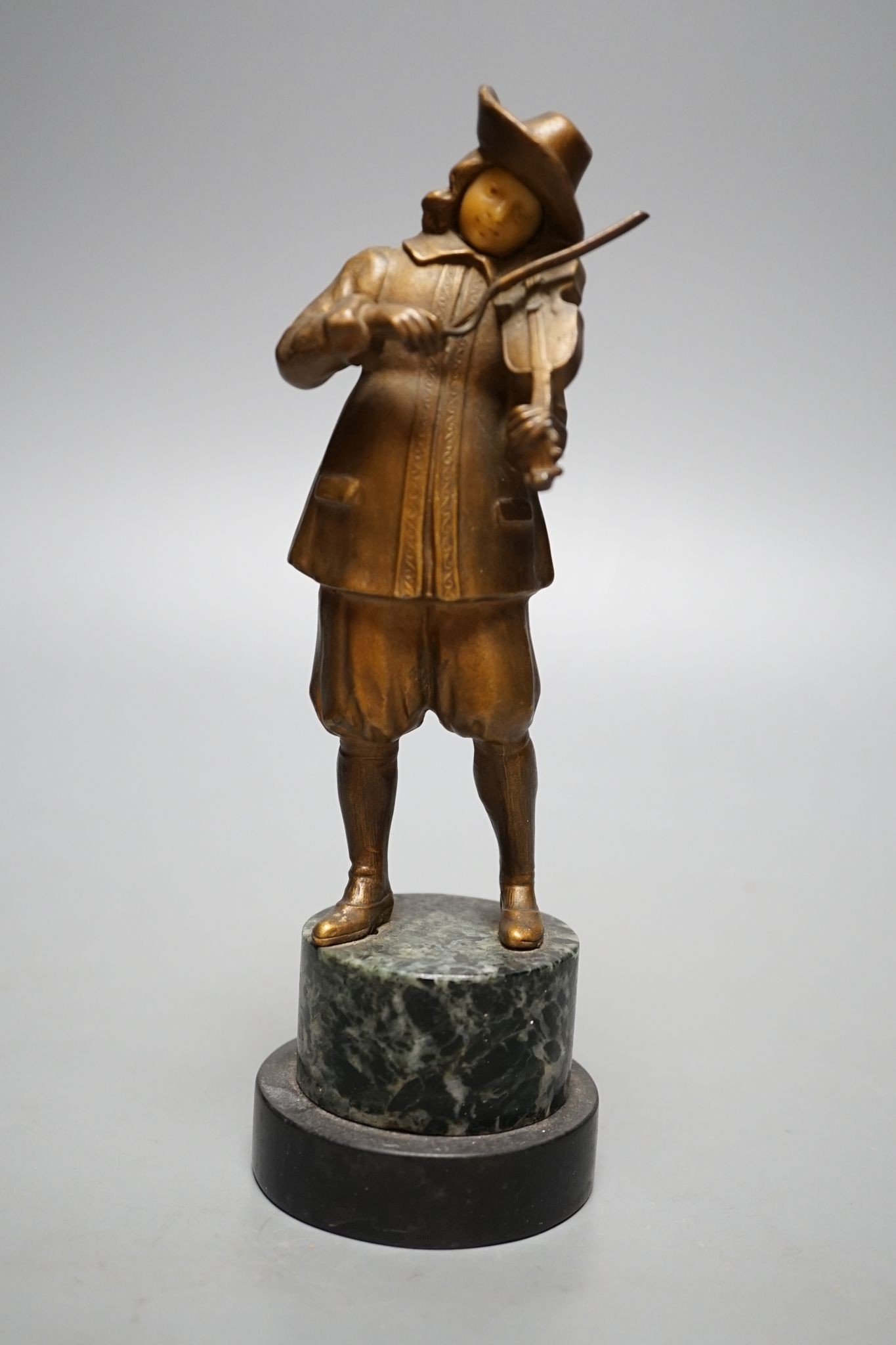A pair of gilt spelter figures of magicians., 19 cms high.